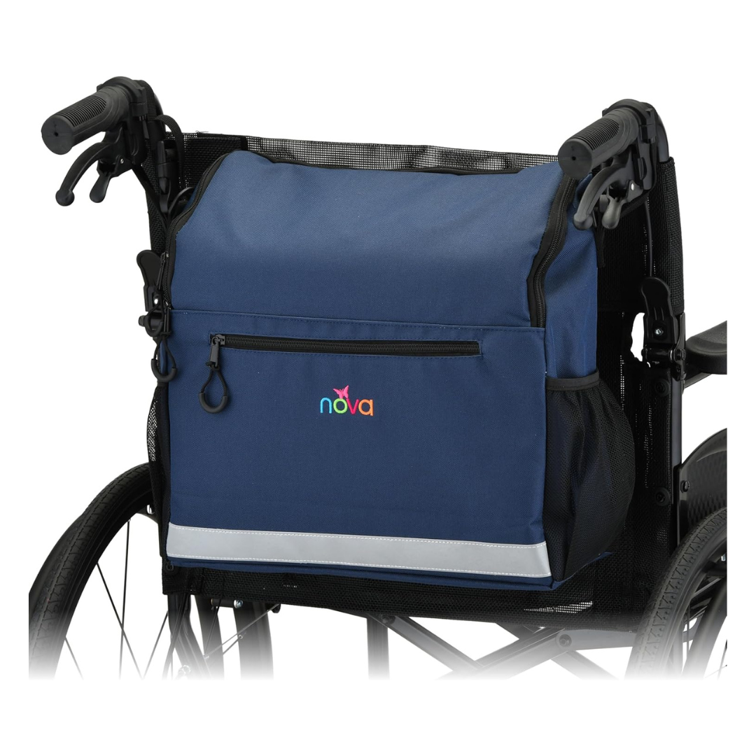 The NOVA Wheelchair Bag with Cup Holder is a waterproof navy blue accessory with a zippered front pocket, reflective strip, and nova logo. It easily attaches to the back handles of a black wheelchair for convenient storage.